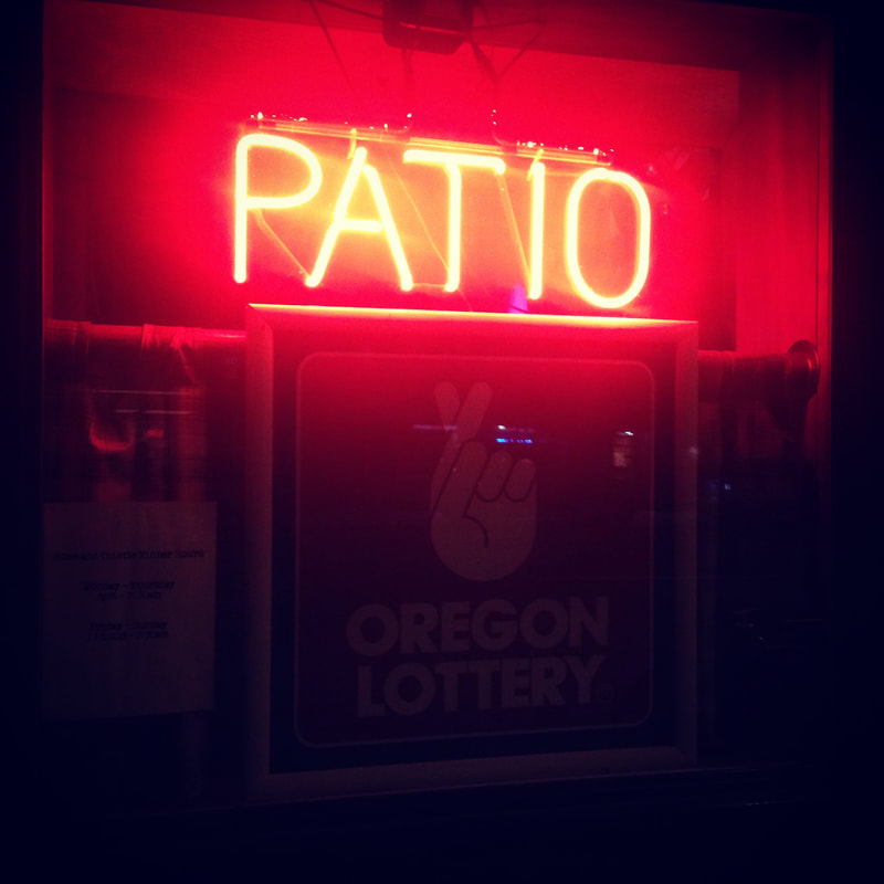 neon sign reading patio